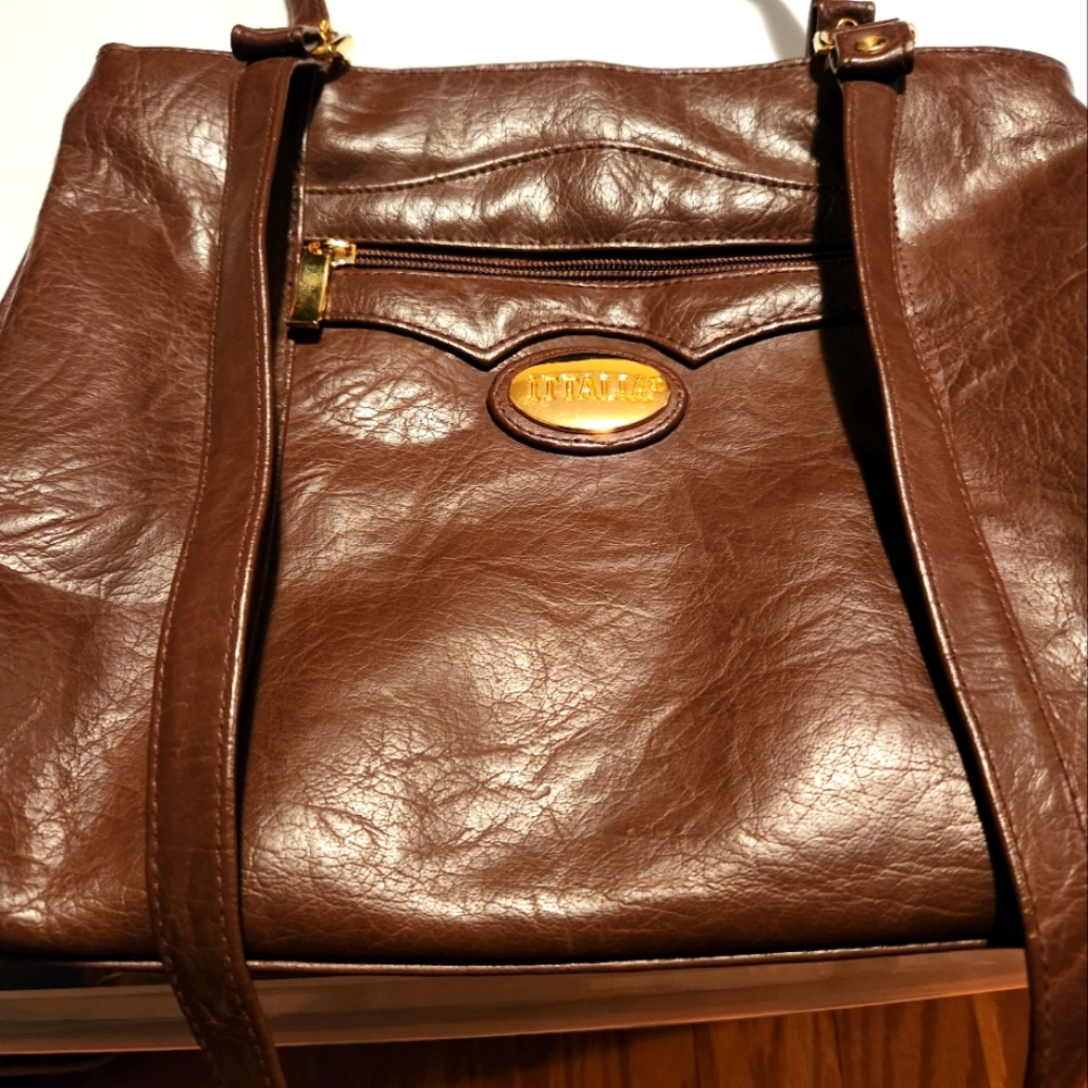 Woman's ITTALIA Brown Leather bag, with side pockets . Like new